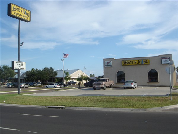 The Boots 'N Jeans storefront and roadside sign on West Expressway 83